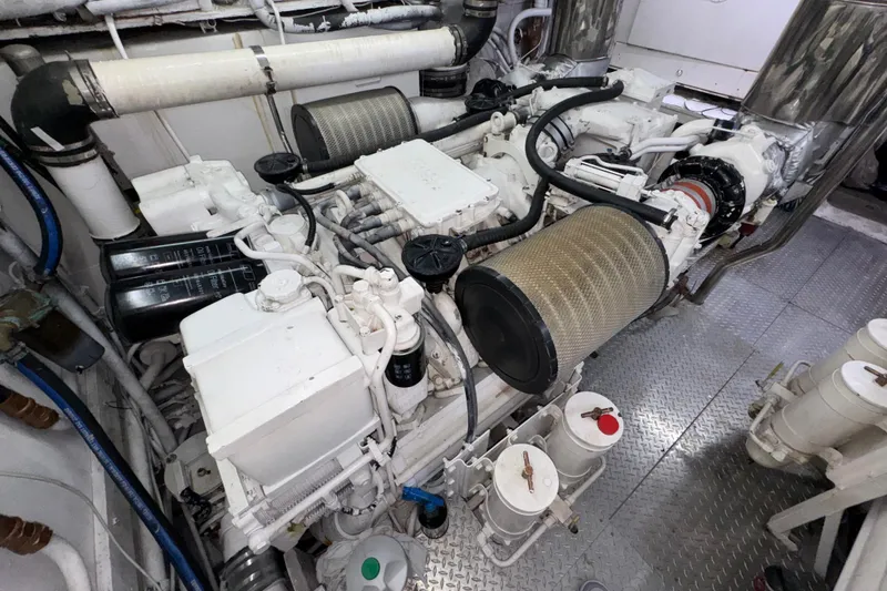 Slide: The Image of Engine room of a 1998 Azimut 85 Ultimate yacht, showcasing mechanical components. - 57