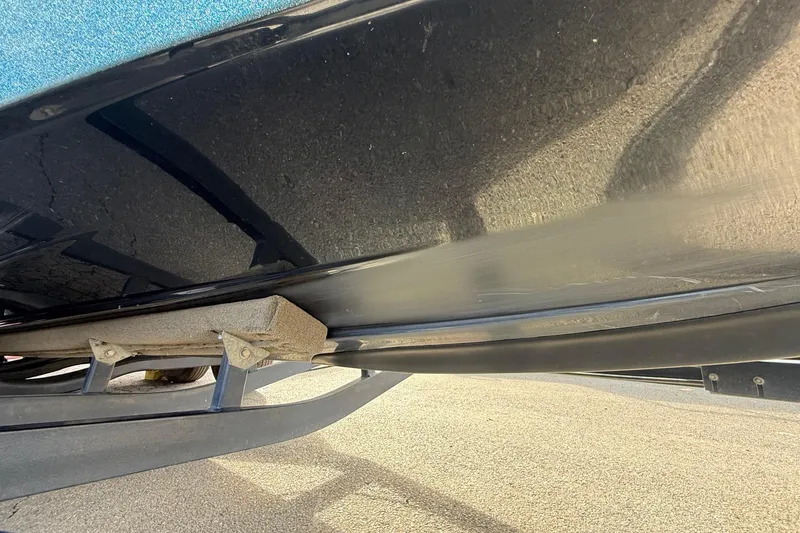 Slide: The Image of 2013 Ranger Z520C Carbon Comanche boat hull on trailer, close-up view. - 12