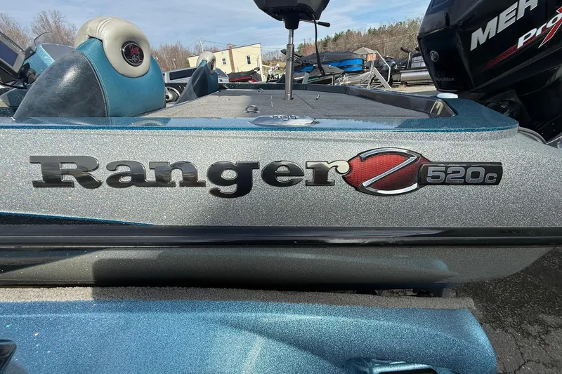 Slide: The Image of 2013 Ranger Z520C Carbon Comanche boat with metallic finish and logo detail. - 2
