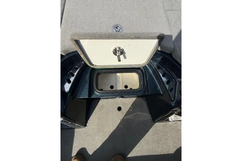 Slide: The Image of 2013 Ranger Z520C Carbon Comanche boat storage compartment, open with visible interior. - 32