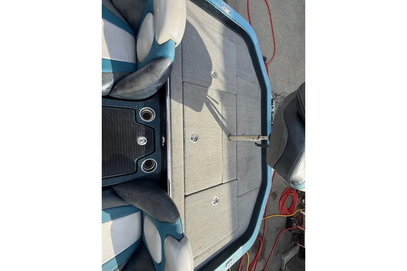 Slide: The Image of 2013 Ranger Z520C Carbon Comanche boat interior with seating and storage compartments. - 33