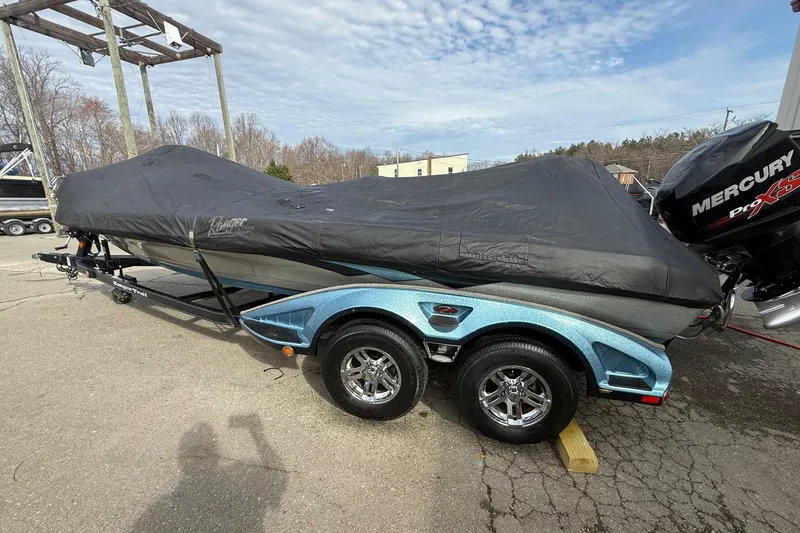 Slide: The Image of 2013 Ranger Z520C Carbon Comanche boat covered, on trailer with Mercury Pro XS engine. - 42