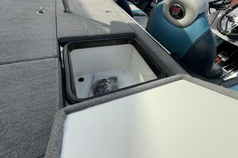 Slide: The Image of 2013 Ranger Z520C Carbon Comanche boat interior with open storage compartment. - 22