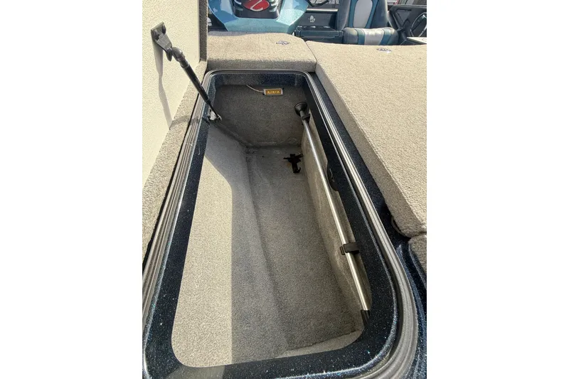 Slide: The Image of Open storage compartment in 2013 Ranger Z520C Carbon Comanche boat, showcasing interior space. - 25