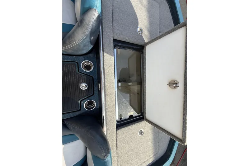 Slide: The Image of 2013 Ranger Z520C Carbon Comanche boat interior with open storage compartment. - 34