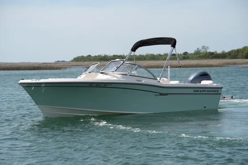 The Image of 2017 Grady-White Freedom 205 boat cruising on calm waters. - 0