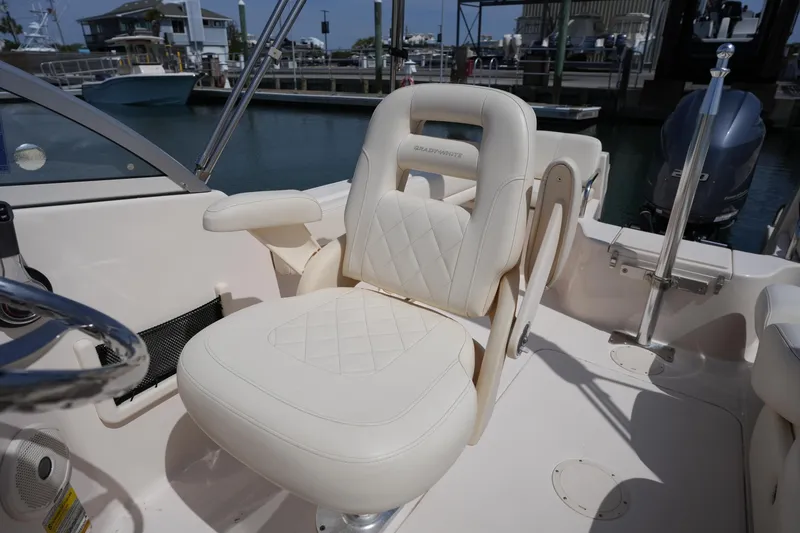 Slide: The Image of Luxurious seating on 2017 Grady-White Freedom 205 boat, docked at marina. - 16