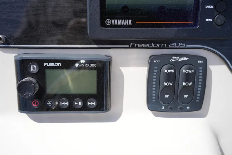 Slide: The Image of Control panel of a 2017 Grady-White Freedom 205 boat with Fusion and Bennett systems. - 21