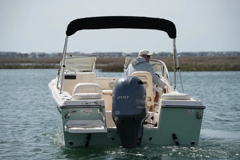 Slide: The Image of 2017 Grady-White Freedom 205 boat cruising on water with Yamaha engine. - 8
