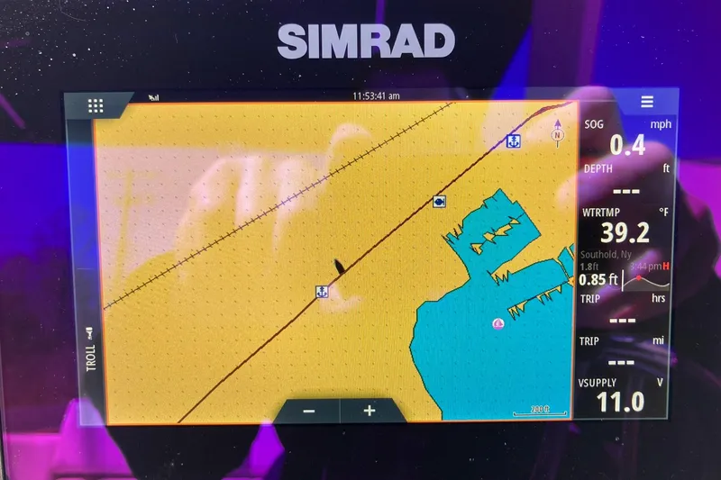 Slide: The Image of Simrad navigation display on 2022 Chaparral 267 SSX OB boat showing map and data. - 16