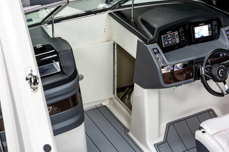 Slide: The Image of Manufacturer Provided Image: 2022 Chaparral 267 SSX OB boat interior with modern dashboard and controls. - 33