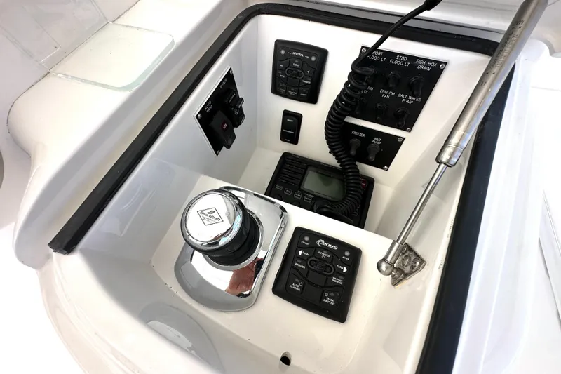 Slide: The Image of Control panel of a 2012 Viking 42 Open boat with various switches and devices. - 16