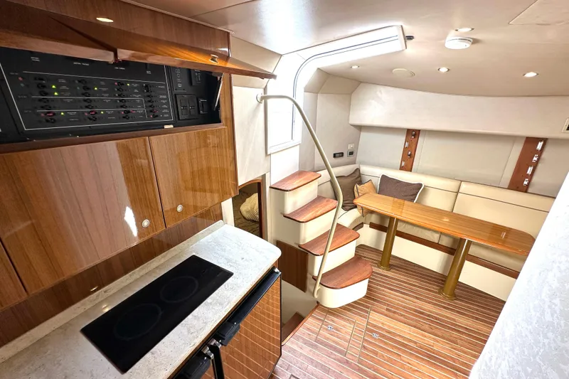 Slide: The Image of Luxurious interior of 2012 Viking 42 Open yacht with modern kitchen and cozy seating area. - 20