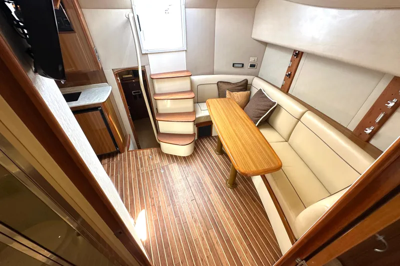 Slide: The Image of Luxurious interior of 2012 Viking 42 Open yacht with elegant seating and wooden flooring. - 24