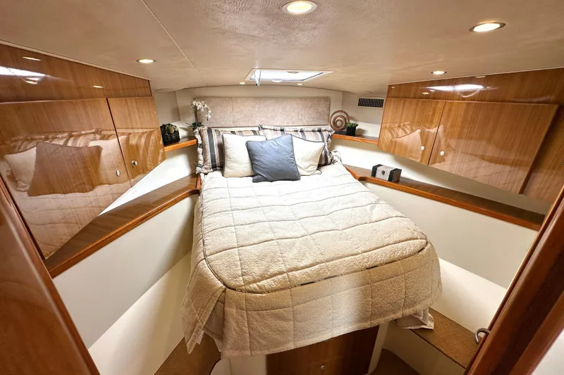 Slide: The Image of Luxurious cabin interior of 2012 Viking 42 Open yacht with cozy bedding. - 26