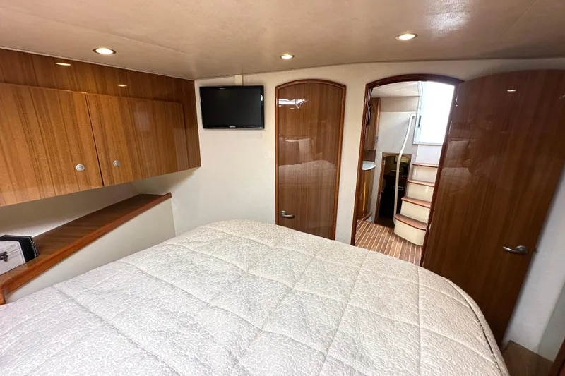 Slide: The Image of Luxurious interior of 2012 Viking 42 Open yacht with cozy bedroom and modern amenities. - 27