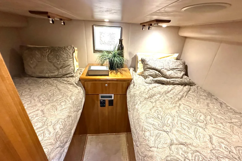 Slide: The Image of Luxurious cabin interior of 2012 Viking 42 Open yacht with twin beds and elegant decor. - 30