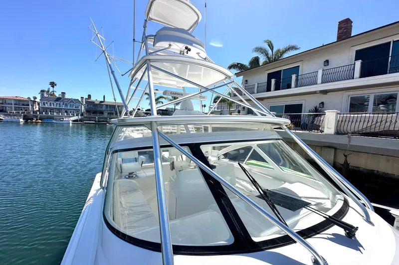 Slide: The Image of 2012 Viking 42 Open yacht docked near waterfront homes. - 7