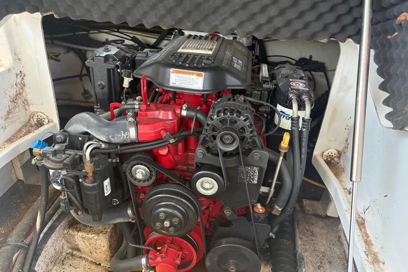Slide: The Image of Engine compartment of a 2007 Crownline 252 EX boat, showcasing detailed mechanical components. - 19