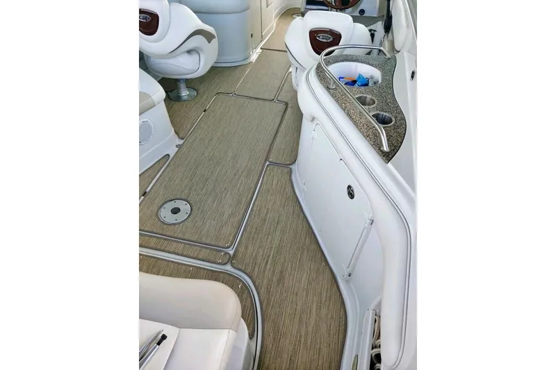Slide: The Image of 2007 Crownline 252 EX boat interior with seating and storage compartments. - 9
