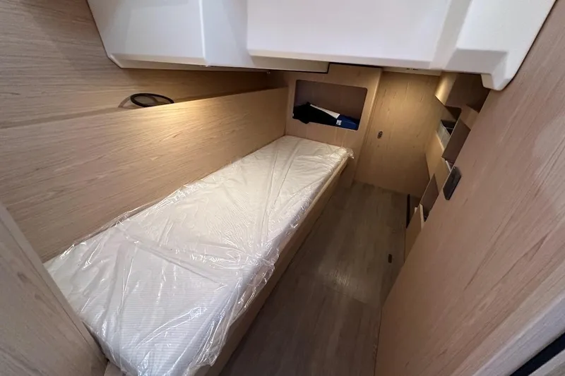 Slide: The Image of Interior cabin of 2024 Beneteau Swift Trawler 41 Sedan with single bed. - 77