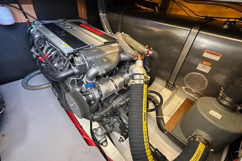 Slide: The Image of Engine room of 2024 Beneteau Swift Trawler 41 Sedan, showcasing advanced marine engine components. - 82
