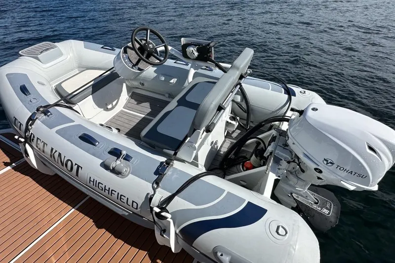 Slide: The Image of Inflatable boat with Tohatsu motor on water, associated with 2024 Beneteau Swift Trawler 41 Sedan. - 88