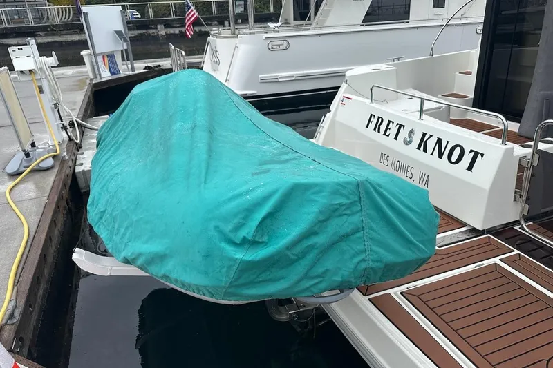 Slide: The Image of 2024 Beneteau Swift Trawler 41 Sedan docked, covered dinghy, Des Moines, WA. - 92