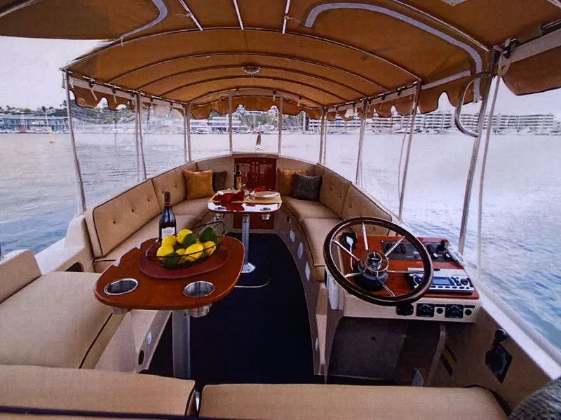 Slide: The Image of Interior of a 2017 Duffy 22 boat on the water. - 8