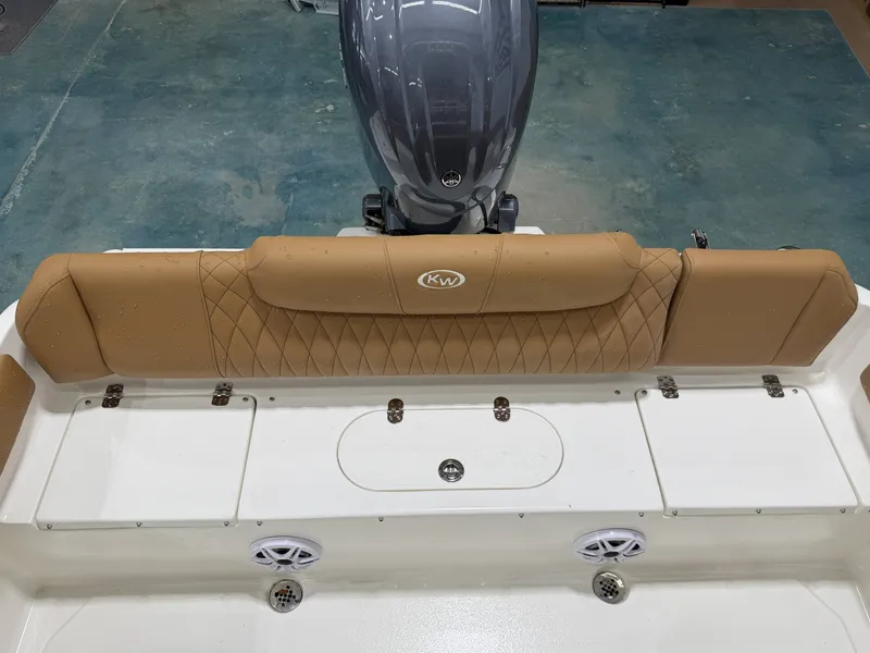 Slide: The Image of Key West 219FSR 2026 boat rear seating with motor view. - 12