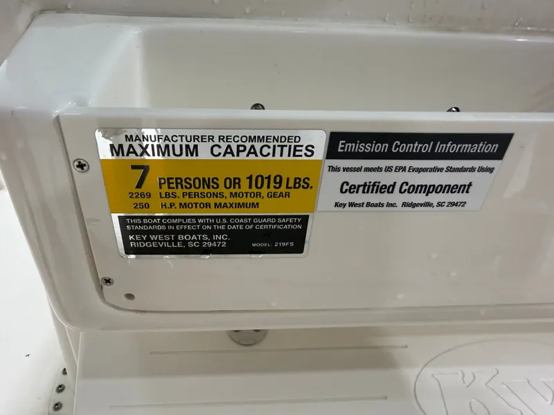 Slide: The Image of Key West 219FSR boat capacity label, 7 persons or 1019 lbs, year 2026. - 18