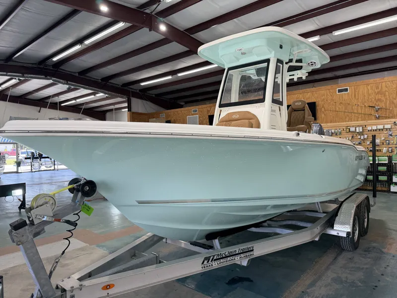 Slide: The Image of 2026 Key West 219FSR boat on trailer in warehouse. - 6