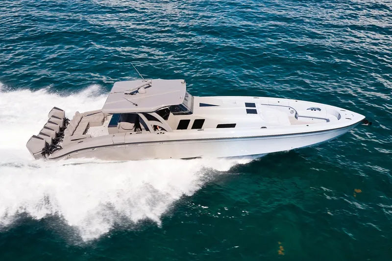The Image of Midnight Express 52 Vitesse yacht cruising on open water, showcasing sleek design and powerful engines. - 0