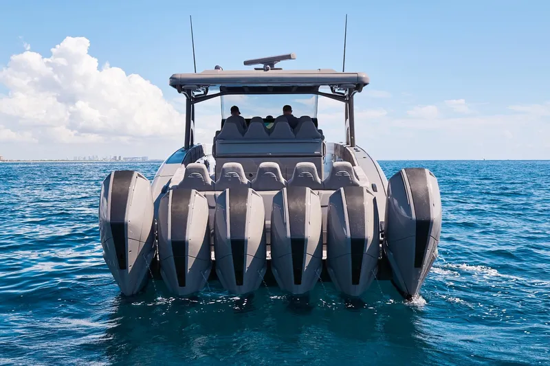 Slide: The Image of Midnight Express 52 Vitesse boat with multiple engines cruising on open water. - 10