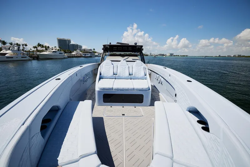 Slide: The Image of Luxury Midnight Express 52 Vitesse boat with spacious seating, docked by the waterfront. - 11
