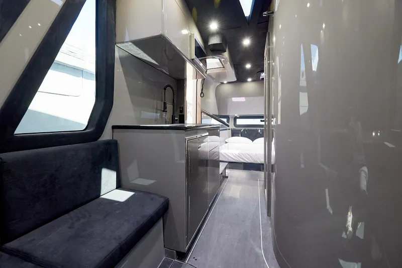 Slide: The Image of Luxurious interior of Midnight Express 52 Vitesse yacht with modern kitchen and cozy sleeping area. - 22