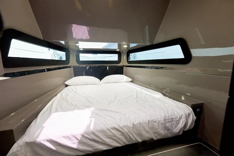 Slide: The Image of Luxurious cabin interior of Midnight Express 52 Vitesse with a comfortable bed and sleek design. - 23