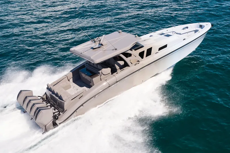 Slide: The Image of Midnight Express 52 Vitesse yacht cruising swiftly on open ocean waters. - 3