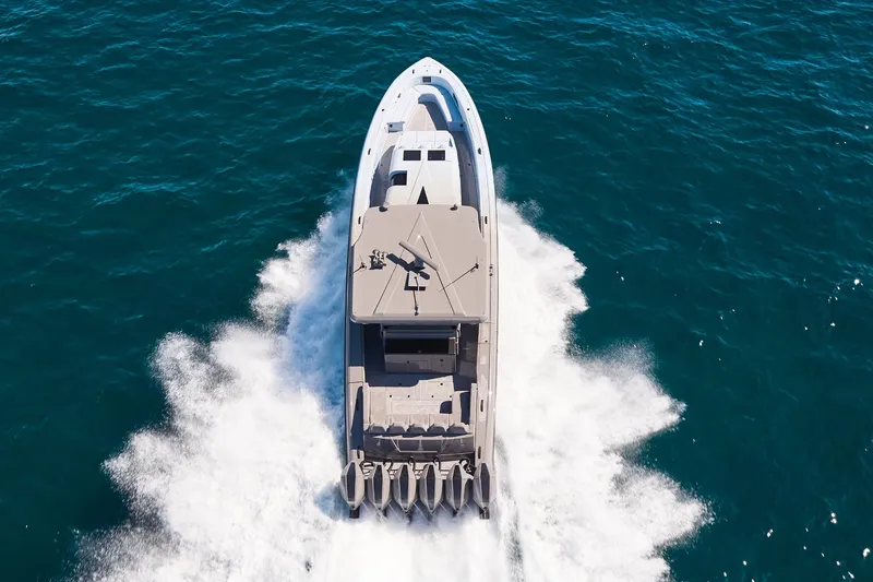 Slide: The Image of Midnight Express 52 Vitesse boat speeding on open ocean waters, aerial view. - 4