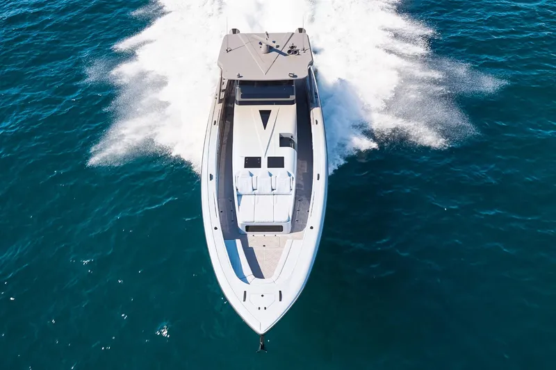 Slide: The Image of Aerial view of Midnight Express 52 Vitesse yacht speeding on blue ocean waters. - 5