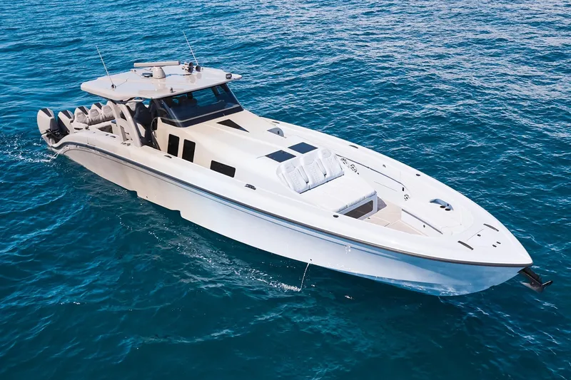 Slide: The Image of Luxury Midnight Express 52 Vitesse boat cruising on clear blue ocean waters. - 8