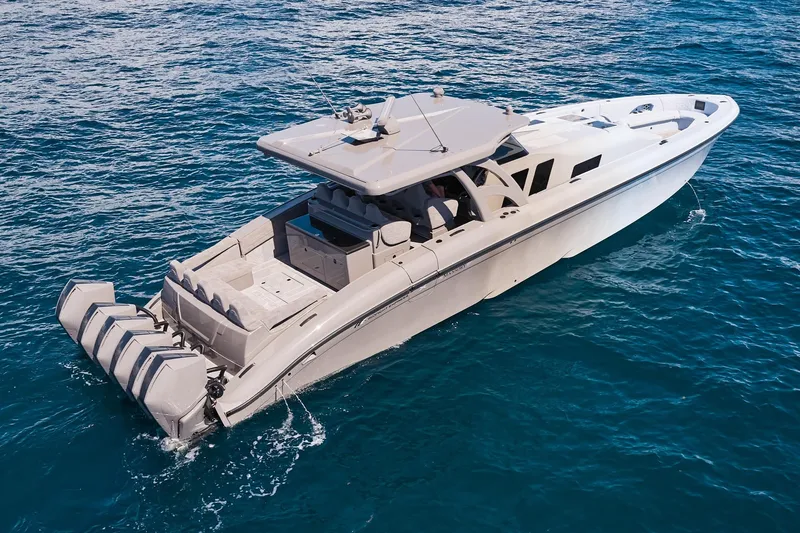 Slide: The Image of Midnight Express 52 Vitesse luxury boat cruising on clear blue ocean waters. - 9