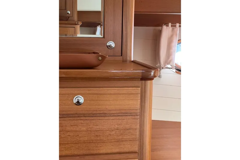 Slide: The Image of Luxurious wooden interior of 2027 Hunt Yachts 63 Flybridge, featuring elegant cabinetry and fixtures. - 11