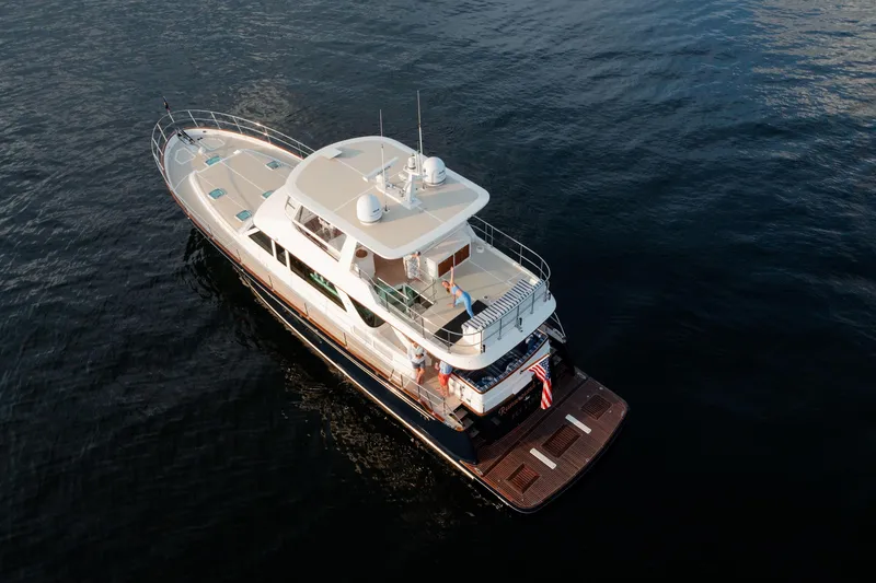Slide: The Image of Aerial view of 2027 Hunt Yachts 63 Flybridge on calm water. - 15