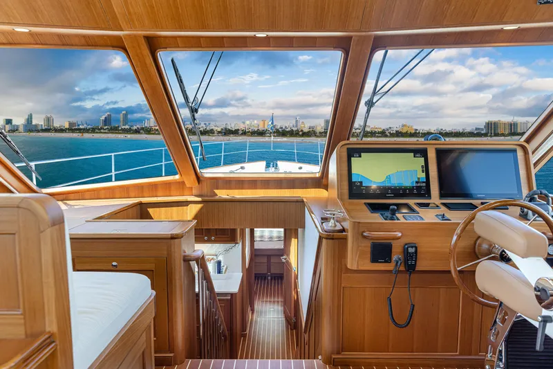 Slide: The Image of Luxurious 2027 Hunt Yachts 63 Flybridge helm with panoramic ocean view and advanced navigation systems. - 2