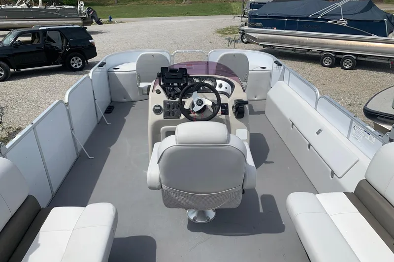 Slide: The Image of Pontoon boat interior with steering console, white seating, and open deck. YAMAHA G3 V22FC, 2019 model. - 10