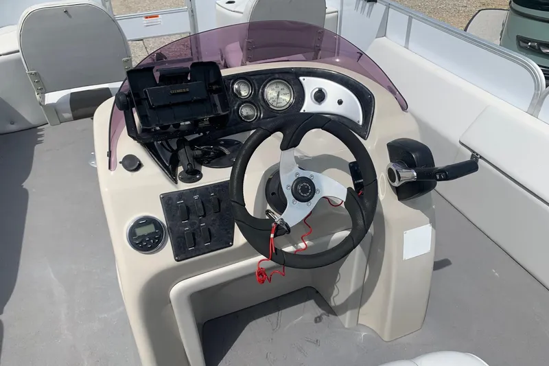 Slide: The Image of Steering console of a 2019 YAMAHA G3 V22FC boat with gauges and controls. - 11