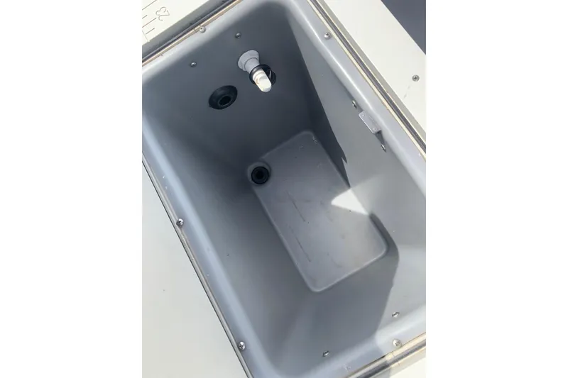 Slide: The Image of Yamaha G3 V22FC 2019 boat storage compartment, gray interior, open lid view. - 18