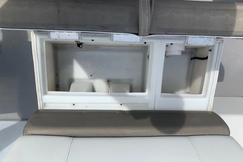 Slide: The Image of Open storage compartment on a 2019 YAMAHA G3 V22FC boat seat. - 19