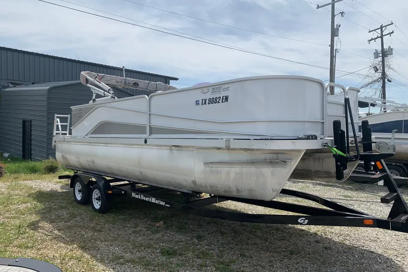 Slide: The Image of 2019 YAMAHA G3 V22FC pontoon boat on trailer, parked outdoors. - 2